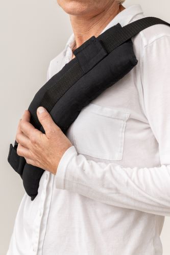 Seat belt cushion positioned on shoulder to reduce pressure after surgery